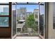 A balcony view showing nearby city buildings at 2955 Inca St # 2D, Denver, CO 80202