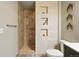 Bathroom features an earth-toned tiled shower with cubbies, and a vanity at 2955 Inca St # 2D, Denver, CO 80202