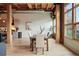 Open concept dining area featuring wood beams, exposed ductwork, and lots of natural light at 2955 Inca St # 2D, Denver, CO 80202