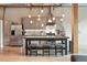 Modern kitchen featuring stainless steel appliances, an island with seating, and sleek gray cabinetry at 2955 Inca St # 2D, Denver, CO 80202