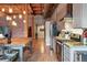Modern kitchen featuring stainless steel appliances, concrete countertops, and open shelving at 2955 Inca St # 2D, Denver, CO 80202