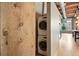 Modern stackable washer and dryer neatly tucked away, optimizing space and convenience at 2955 Inca St # 2D, Denver, CO 80202