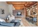Bright living room with brick accent wall, wood floors, and comfortable seating at 2955 Inca St # 2D, Denver, CO 80202