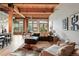 Spacious living room features large windows, hardwood floors, modern decor, and comfortable seating at 2955 Inca St # 2D, Denver, CO 80202