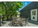 Outdoor deck with a dining table and seating, perfect for entertaining or relaxing outside at 6505 W Hampden Ave, Lakewood, CO 80227