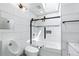 Modern bathroom featuring a stylish tub with glass enclosure and sleek, contemporary fixtures at 6505 W Hampden Ave, Lakewood, CO 80227