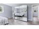 Cozy bedroom with hardwood floors and a mirrored wardrobe closet at 6505 W Hampden Ave, Lakewood, CO 80227