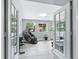 Bright exercise room with floor to ceiling windows and fitness equipment at 6505 W Hampden Ave, Lakewood, CO 80227