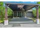 Inviting home entrance with a covered porch, sleek front door, and stylish exterior details at 6505 W Hampden Ave, Lakewood, CO 80227