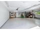 Spacious garage with ample storage, a side entrance, and a clean, organized space at 6505 W Hampden Ave, Lakewood, CO 80227