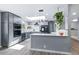 Contemporary kitchen with stainless steel appliances, sleek cabinetry, and ample counter space at 6505 W Hampden Ave, Lakewood, CO 80227