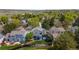 Aerial view showcases a backyard featuring a hot tub and patio, surrounded by lush greenery and trees at 11427 King Way, Westminster, CO 80031