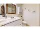 Bright bathroom featuring a vanity, mirror, toilet and wall art at 11427 King Way, Westminster, CO 80031