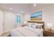 Bedroom featuring a neutral color palette, bed with nightstands and a bright window at 11427 King Way, Westminster, CO 80031