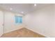 Empty carpeted bedroom with a window and baseboard trim at 11427 King Way, Westminster, CO 80031