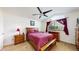 Bedroom with a ceiling fan, full bed, window, and wood furniture set at 11427 King Way, Westminster, CO 80031