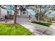 Beautiful townhome featuring stone accents, attached garage, driveway, and healthy green lawn at 11427 King Way, Westminster, CO 80031