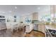 Open floorplan featuring a modern kitchen with stainless steel appliances, dining area, and cozy living space at 11427 King Way, Westminster, CO 80031