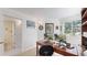 Spacious home office featuring a wood desk, chair, wall decorations and a window at 11427 King Way, Westminster, CO 80031