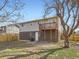 Two-story home features a wood deck overlooking the backyard space at 5153 Scranton St, Denver, CO 80239