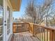 Cozy wooden balcony area with views of the backyard, perfect for relaxing outdoors at 5153 Scranton St, Denver, CO 80239