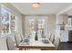 Dining room with a bright window view and french doors to the back, ready for a great party or dinner at 5153 Scranton St, Denver, CO 80239