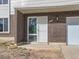 Close-up of the home's entrance with a brick exterior at 5153 Scranton St, Denver, CO 80239