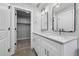 Bathroom with a double vanity and walk-in closet at 2140 S Ash St # 105, Denver, CO 80222