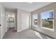 Neutral bedroom with an ensuite bathroom, closet and natural light at 2140 S Ash St # 105, Denver, CO 80222