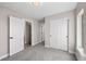 Neutral bedroom with a closet and lots of natural light at 2140 S Ash St # 105, Denver, CO 80222
