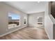 Bright, open living room with hardwood floors and large windows at 2140 S Ash St # 105, Denver, CO 80222