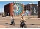 A vibrant Denver neighborhood offers colorful murals and convenient bike lanes for an active lifestyle at 2140 S Ash St # 105, Denver, CO 80222