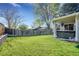 Landscaped backyard featuring a well-maintained lawn and a charming covered patio with a relaxing hot tub at 3561 W 131St Ave, Broomfield, CO 80020