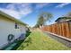 Spacious backyard features a well-maintained lawn, fence, and an air conditioning unit at 3561 W 131St Ave, Broomfield, CO 80020