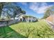 Spacious backyard with a hot tub, lush green lawn, and a private fenced perimeter at 3561 W 131St Ave, Broomfield, CO 80020