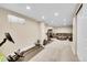 Finished basement featuring a workout area and comfortable seating area at 3561 W 131St Ave, Broomfield, CO 80020