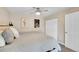 This bedroom features contemporary art, plush pillows, a ceiling fan and a double-door closet at 3561 W 131St Ave, Broomfield, CO 80020