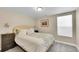 Cozy bedroom featuring a plush bed, soft lighting, and a neutral color scheme at 3561 W 131St Ave, Broomfield, CO 80020