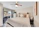 Bright bedroom with a ceiling fan, light-colored wood furniture, and sliding door to the backyard at 3561 W 131St Ave, Broomfield, CO 80020