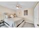 Well-lit bedroom featuring a ceiling fan, neutral walls, and a cozy bed at 3561 W 131St Ave, Broomfield, CO 80020