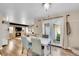 Open floor plan of dining area with fireplace and French door access to yard at 3561 W 131St Ave, Broomfield, CO 80020