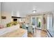 Dining area opens into living room with hardwood floors and French doors at 3561 W 131St Ave, Broomfield, CO 80020