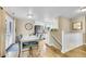 Bright dining area with hardwood floors, and adjacent staircase to the lower level at 3561 W 131St Ave, Broomfield, CO 80020