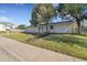 A beautiful view of the exterior of a home with a well manicured lawn and mature trees at 3561 W 131St Ave, Broomfield, CO 80020
