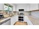 Modern kitchen featuring stainless appliances, stone backsplash, and granite counters at 3561 W 131St Ave, Broomfield, CO 80020