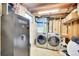 Functional laundry area with modern washer and dryer set, plus a Redhead safe at 3561 W 131St Ave, Broomfield, CO 80020