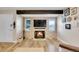 Charming living room featuring a cozy fireplace and hardwood floors at 3561 W 131St Ave, Broomfield, CO 80020