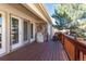 Inviting wooden deck with access to the interior, perfect for outdoor enjoyment at 14033 E Whitaker Dr, Aurora, CO 80015