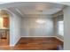 View of dining room featuring tray ceiling and modern chandelier with access to the kitchen at 14033 E Whitaker Dr, Aurora, CO 80015