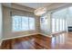 Dining room featuring modern chandelier and window with custom valance at 14033 E Whitaker Dr, Aurora, CO 80015